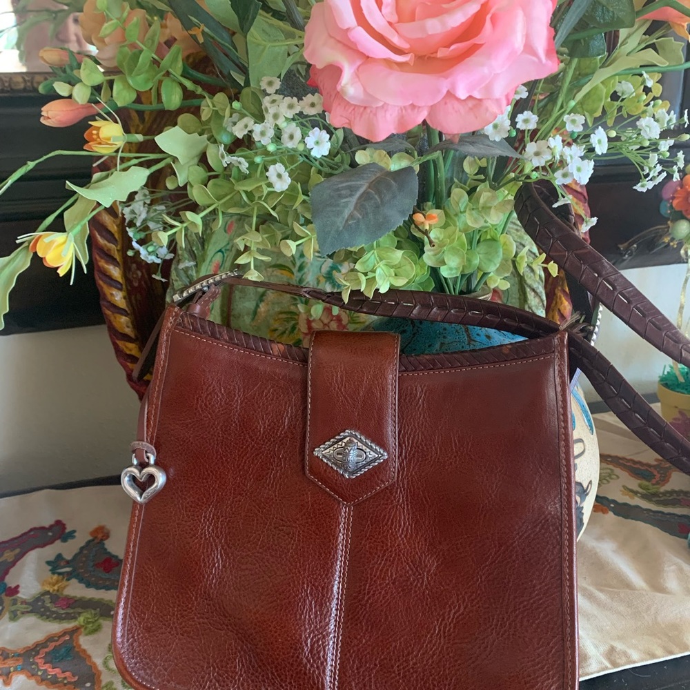 Brighton should bag, leather, silver latch and buckles at each end of strap.